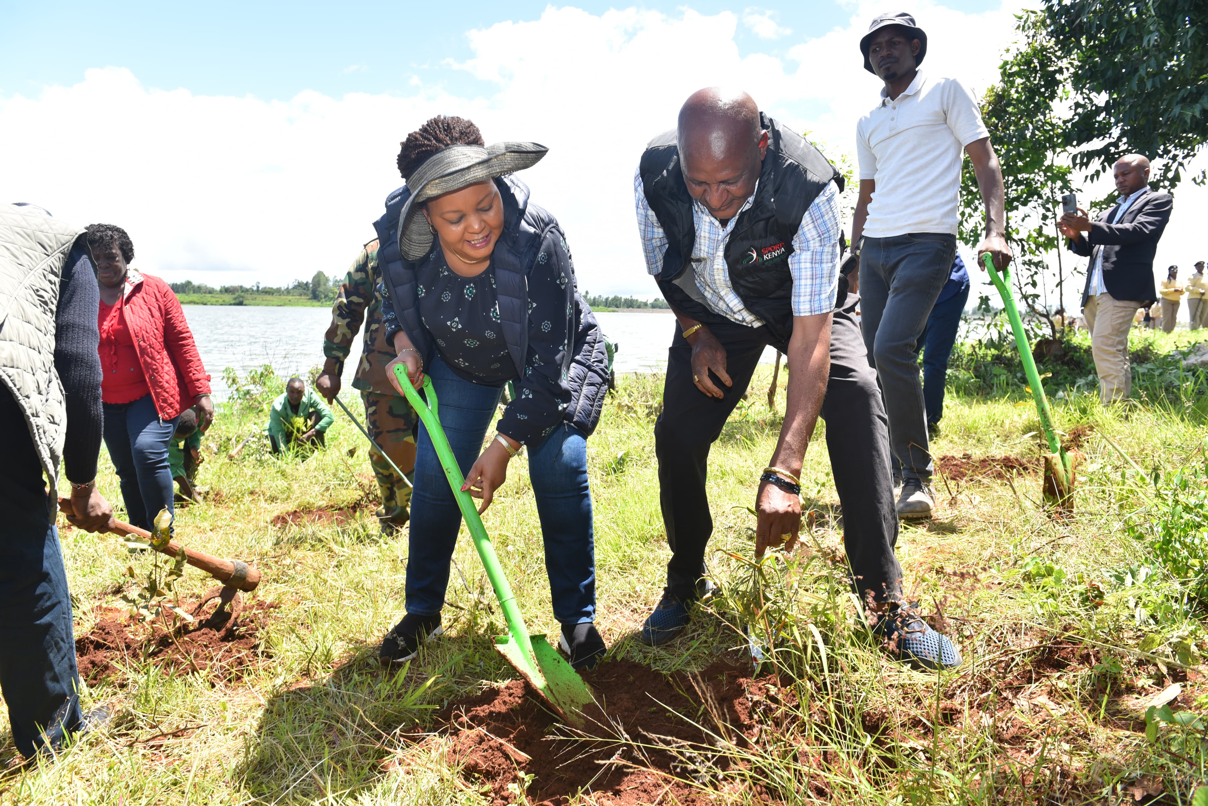 Governor Waiguru participates in planting a tree at Thiba Dam in Kirinyaga County.